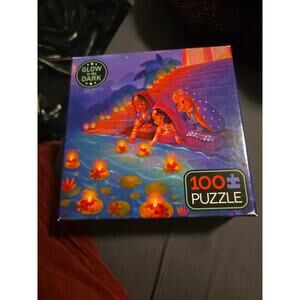 This is a Ceaco Glow in The Dark - Riverside Glow 100 Piece Jigsaw Puzzle